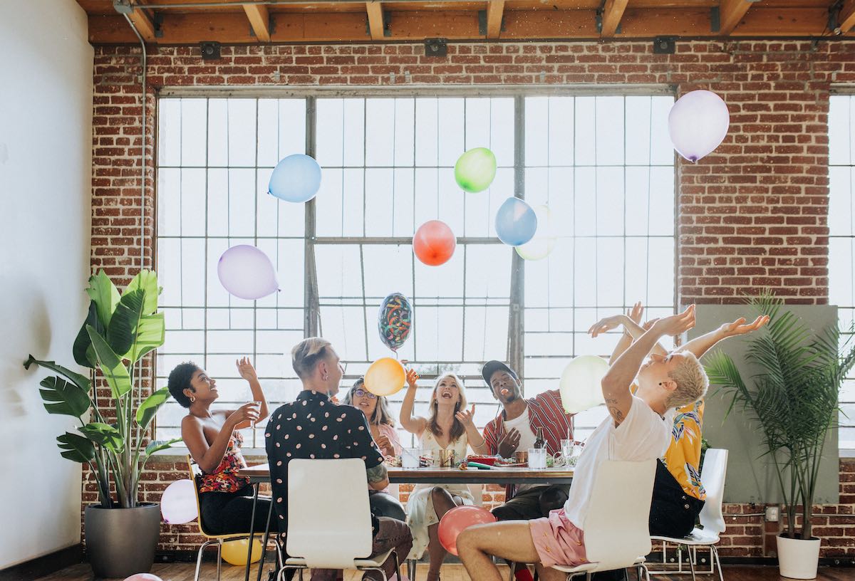 People playing with balloons at a party